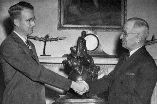 Luis Alvarez shaking hands with President Truman