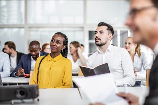 Two safety colleagues attending a meeting in a conference room