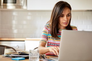 Woman working on a laptop at home