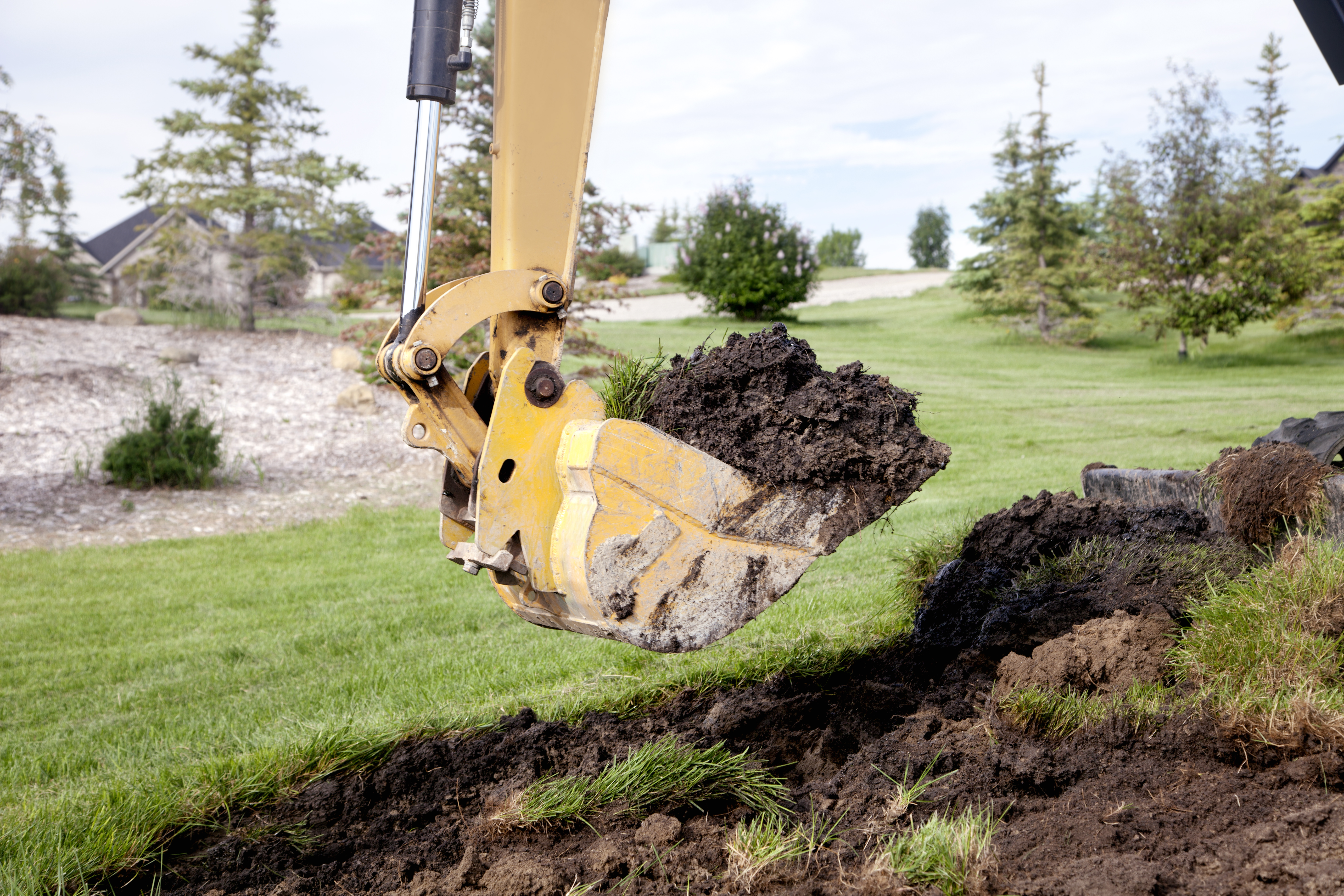 Construction equipment digging a trench