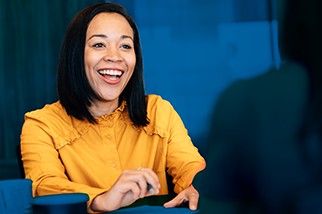 Young woman safety professional in yellow blouse negotiating her salary