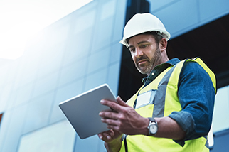 Male-engineer-using-a-digital-tablet-on-worksite
