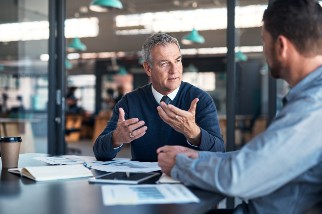 Safety manager giving feedback at conference-table