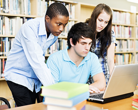 three students library laptop